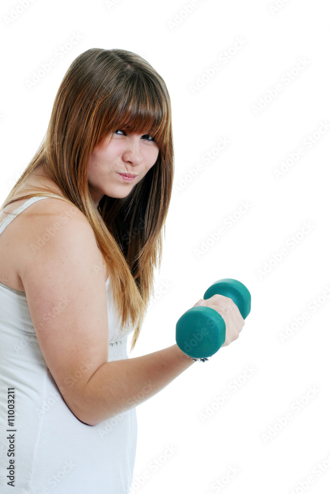 Young female teen working out with a free weight Young female teen working out with a free weight
