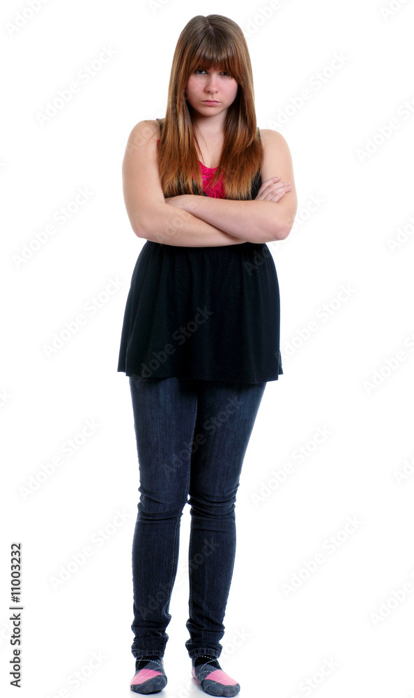Unhappy teenager with her arms crossed Unhappy teenager with her arms crossed