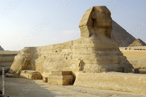 Majestic Sphinx and one of Gizah pyramids in Cairo  Egypt.