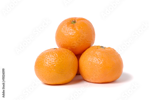 Four tangerines on a white