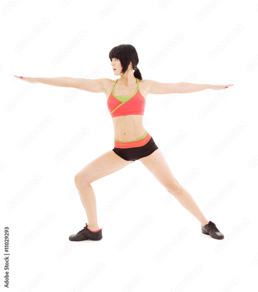 woman practicing virabhadrasana warrior pose woman practicing virabhadrasana warrior pose