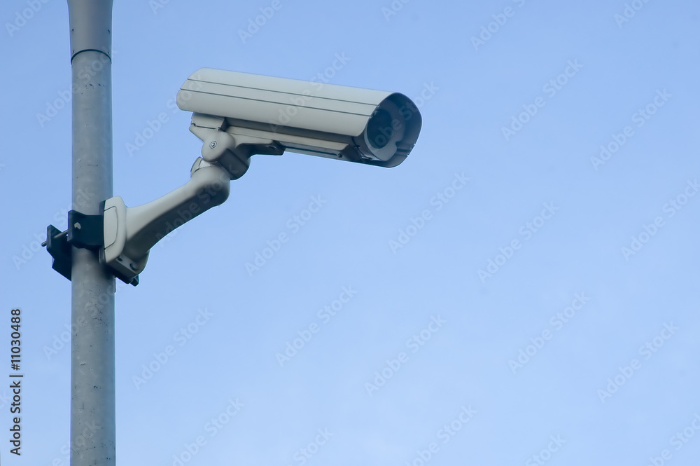 Surveillance Camera mounted on a post looking down Surveillance Camera mounted on a post looking down