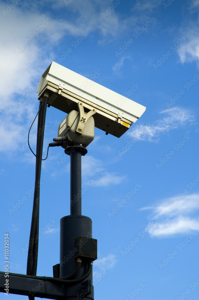 Surveillance Camera mounted on a post looking down Surveillance Camera mounted on a post looking down