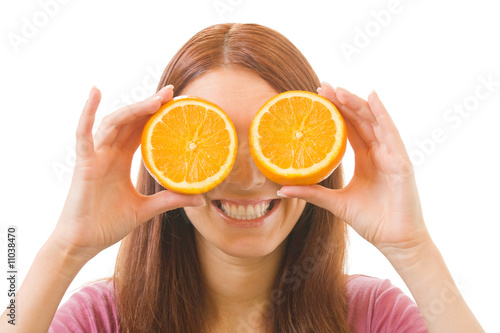 Portrait of happy young woman with orange, isolated