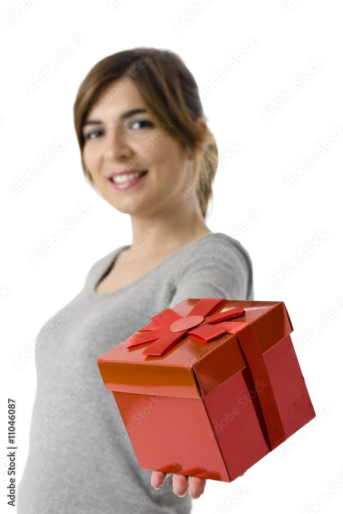 Portrait of a young woman holding a gift isolated