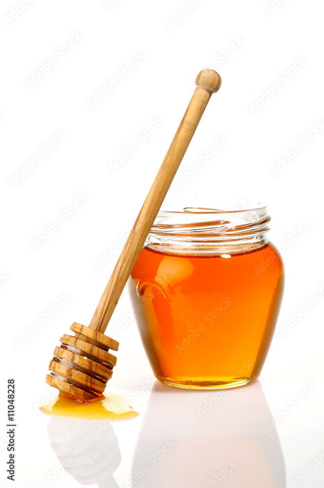 Pot of honey isolated on white Pot of honey isolated on white