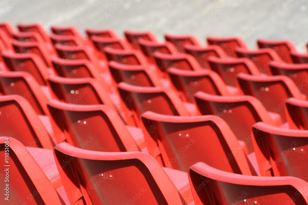 Fototapeta premium plastic red chairs