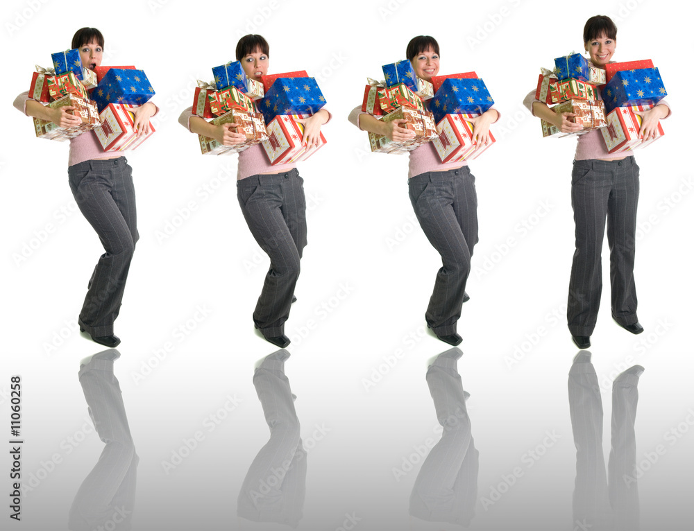 Obraz premium girls with armful of presents isolated over white + reflection
