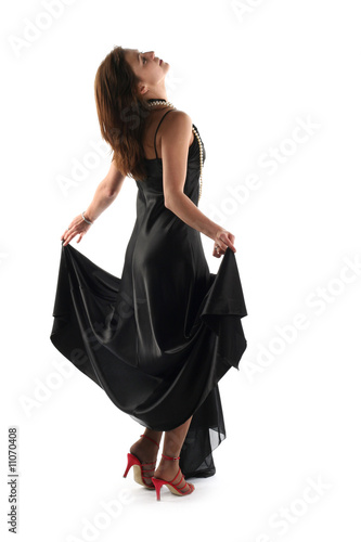 Girl in black dress isolated on white background