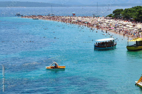 people relaxing on beach photo