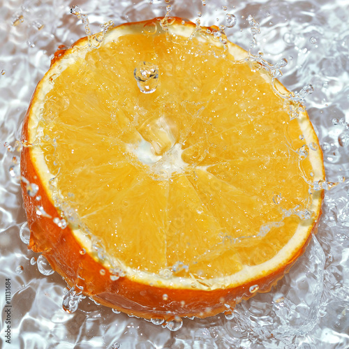 Fototapeta Naklejka Na Ścianę i Meble -  fresh water drops on orange