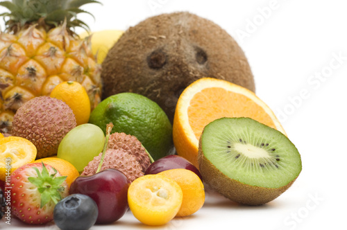 exotic fruits and berries on white background