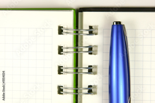 Notebook and a pen closeup photo