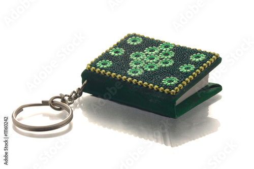 small green key-ring book