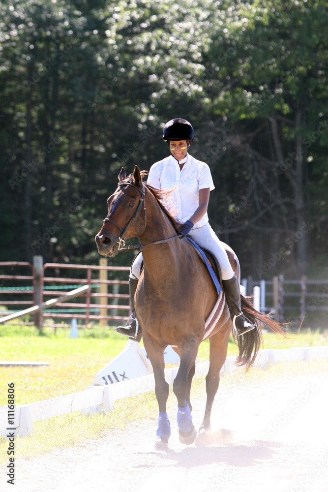 black teenage girl riding her horse in the ring black teenage girl riding her horse in the ring