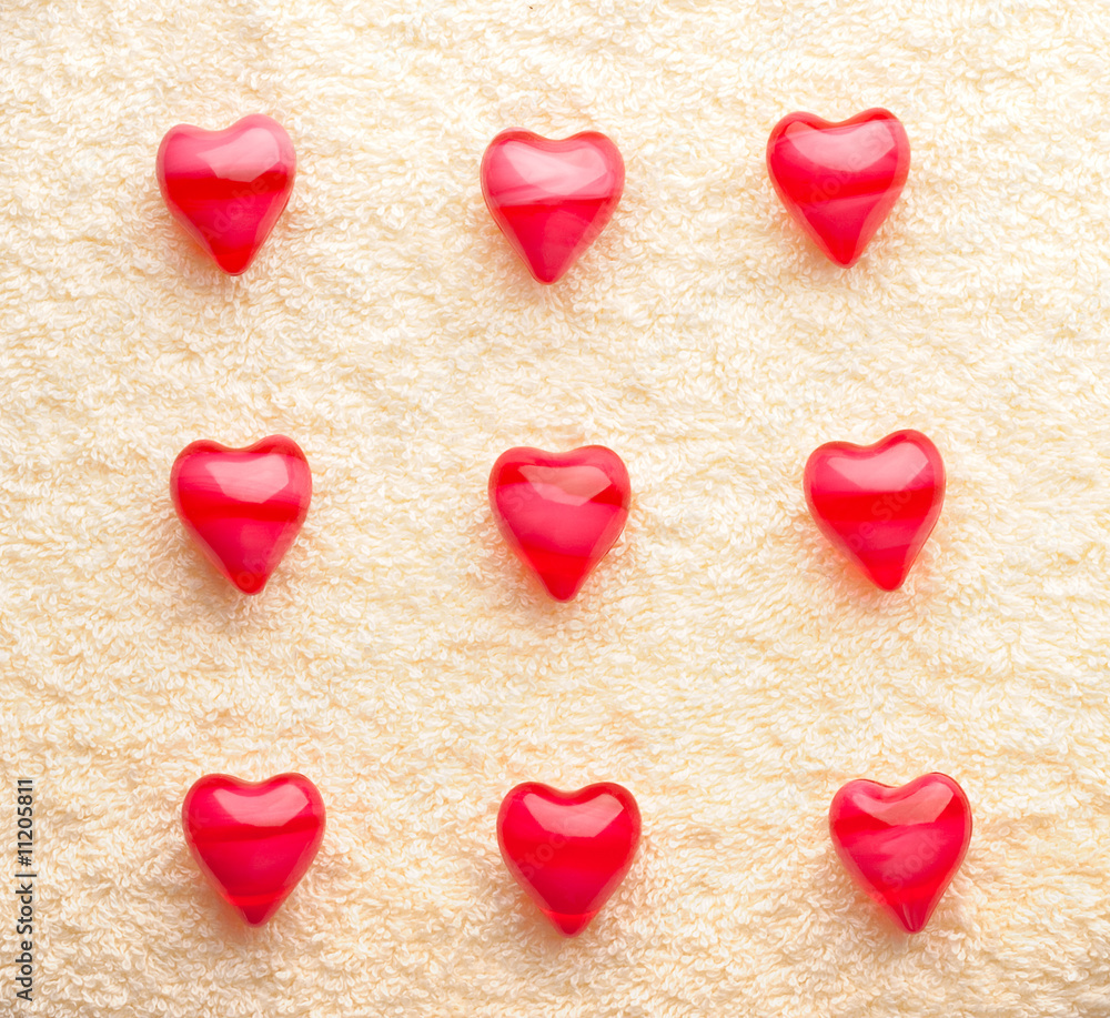 Fototapeta premium array of red nine hearts on towel