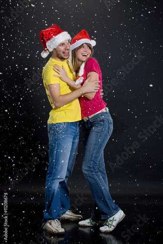 Young Couple Playing WIth Snowflakes