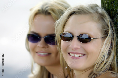 two girls or friends with sunglasses