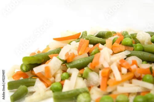 Frozen mixed vegetables in isolated white background