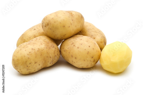 raw potatoes on white background