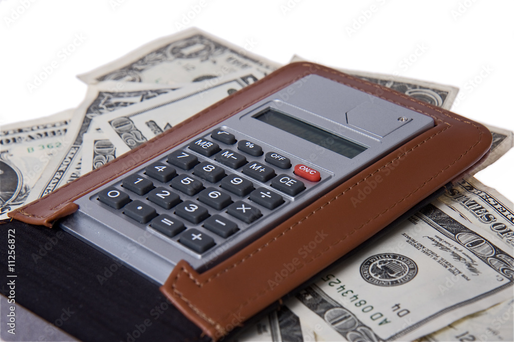 american money with notepad and calculator american money with notepad and calculator