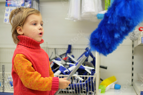 The small customer is delight by a blue brush for a dust