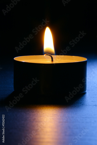 Candle with back lit. Vertical composition.