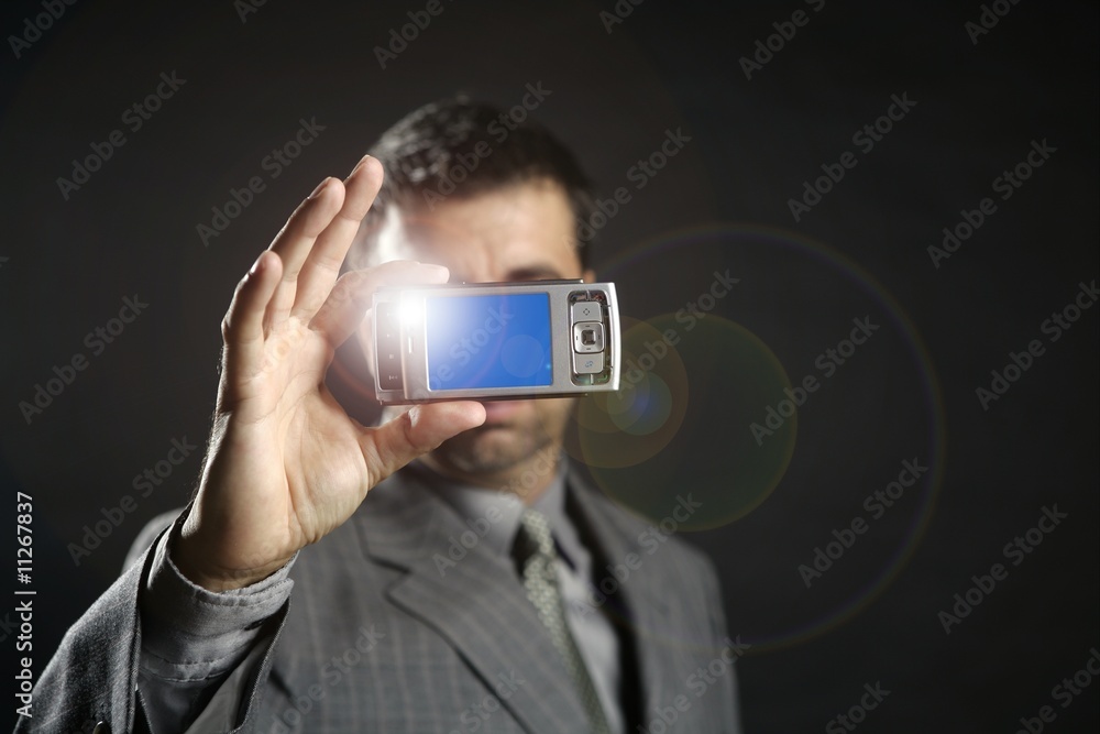 Businessman taking photos, mobile camera Businessman taking photos, mobile camera