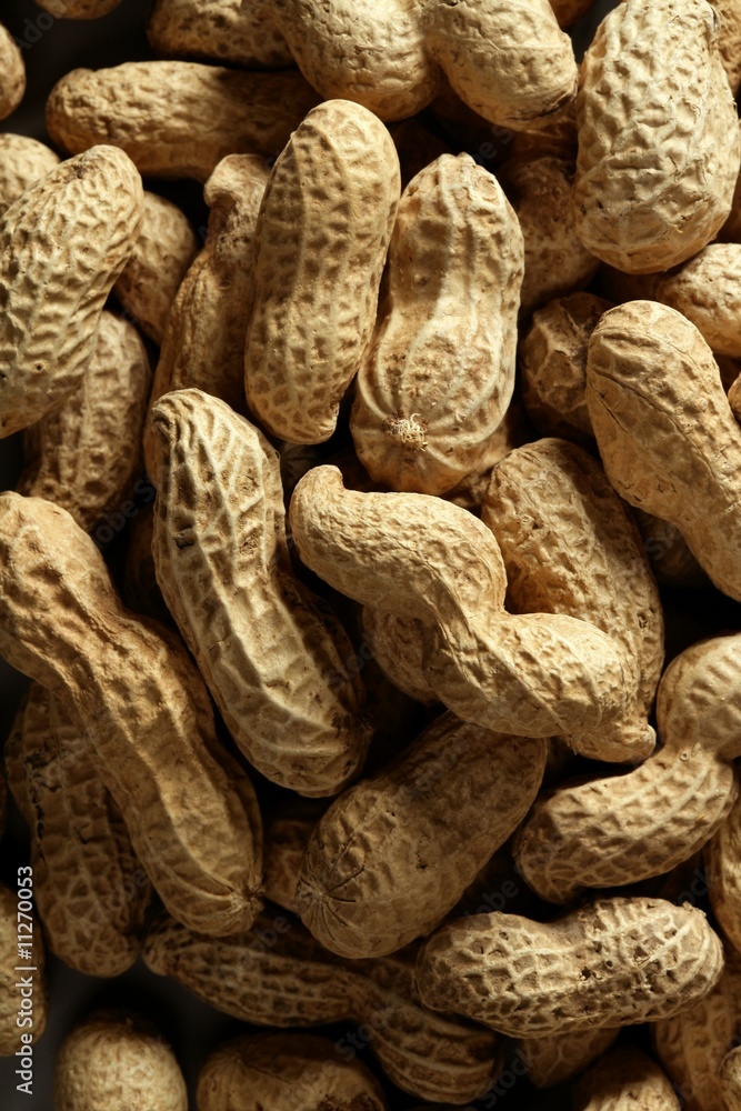 Peanuts macro over wood background Peanuts macro over wood background