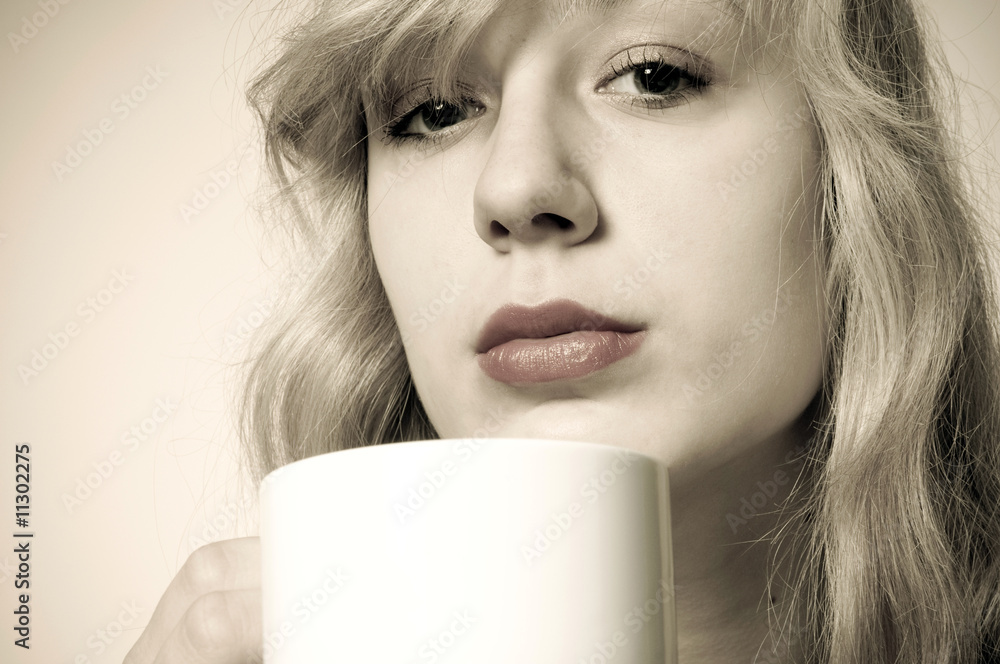 Young woman holding coffe cup Young woman holding coffe cup