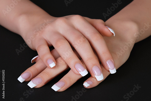 French manicure on black background