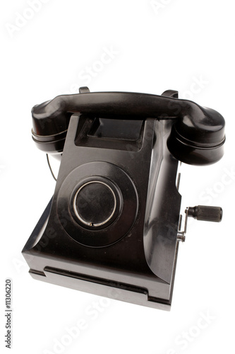 Old black telephone isolated on white background