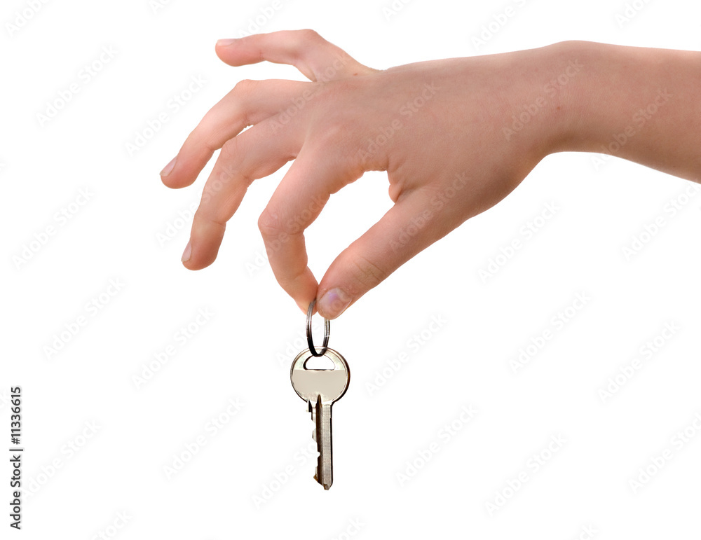 Close up of hand holding key isolated on background Close up of hand holding key isolated on background