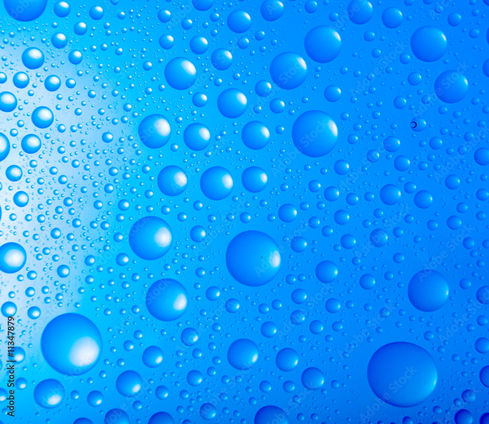 water drops over blue background