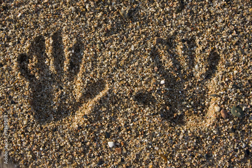 hand print on the beach