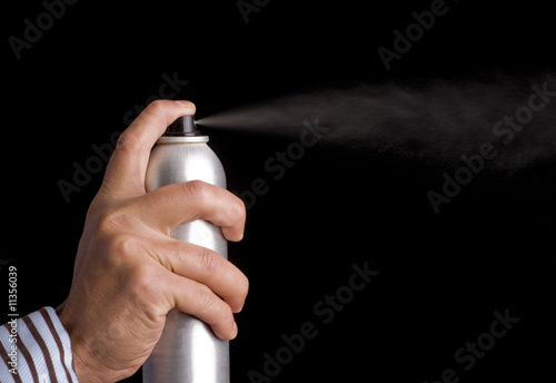 Obraz na plátně Spray shot out of aerosol can