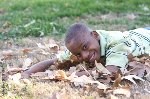 Young Boy in the Leaves