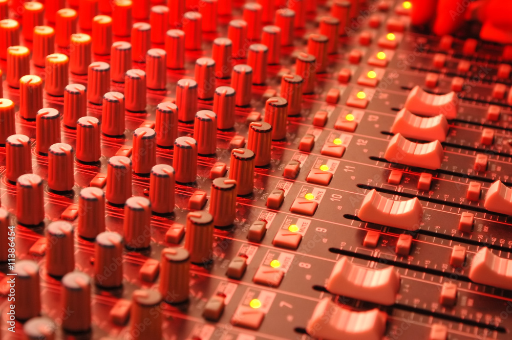 Fototapeta premium music soundboard under red stage lighting