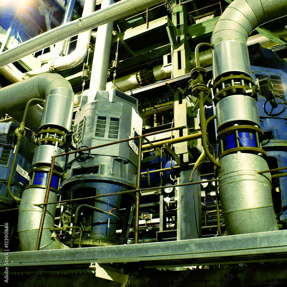 Pipes, tubes, machinery and steam turbine at a power plant Pipes, tubes, machinery and steam turbine at a power plant