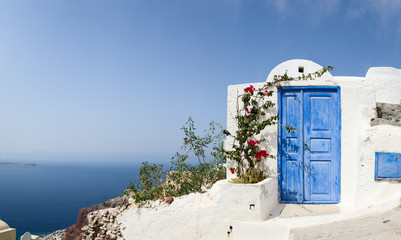Wandcirkels Santorini Blauwe deur naar het niets  © TravelPhotoBloggers