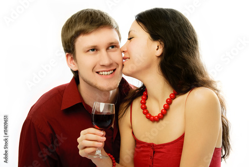 yougn couple drink vine and kiss photo