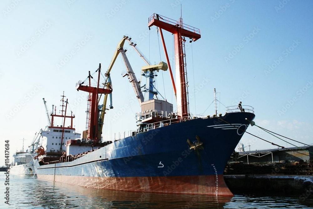 The ship in port under loading
