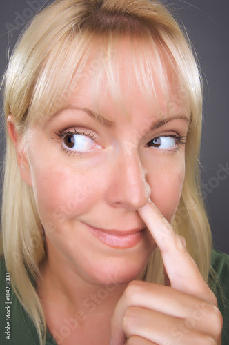 Blond Woman with Finger in ...