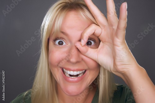 Woman with Okay Sign in Fro...