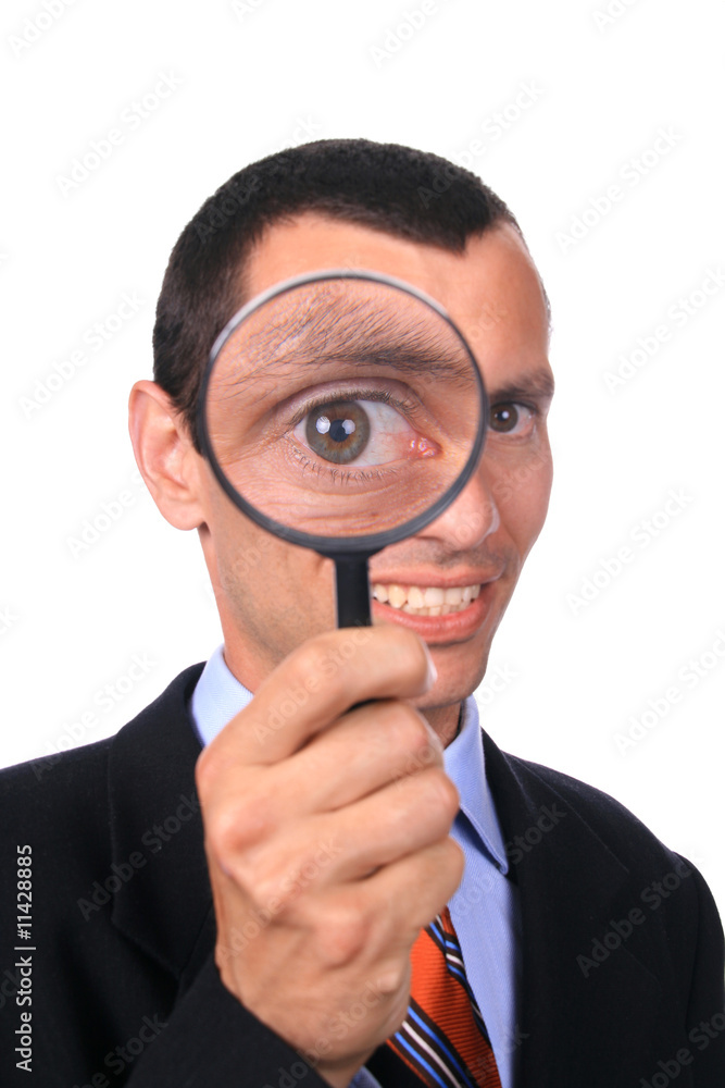 business man with a loupe over white background business man with a loupe over white background