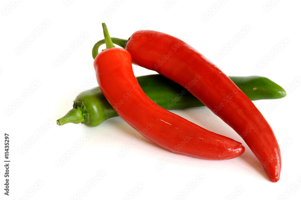 Red and green hot chili peppers isolated on white