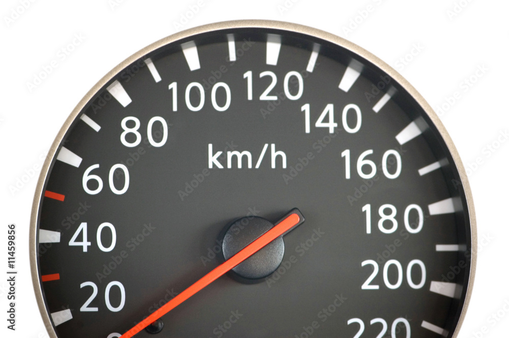 Close up of car speedometer with red arrow Close up of car speedometer with red arrow