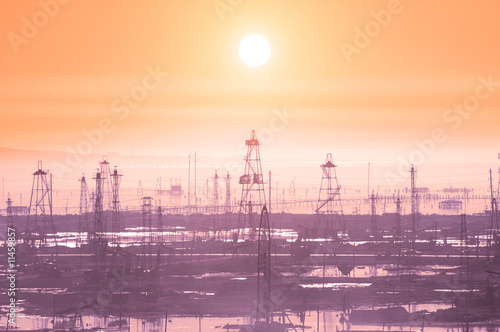 Oil derricks on early morning - Caspian see near Baku