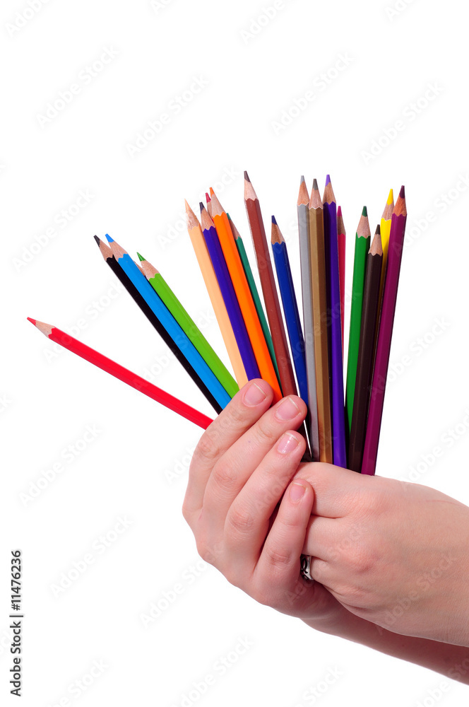 Naklejka premium hand with colored pencils