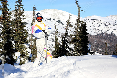 A man is a mountain-skier. photo